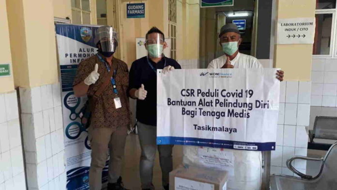 WOM Finance Tasikmalaya Salurkan Bantuan APD dan Sembako