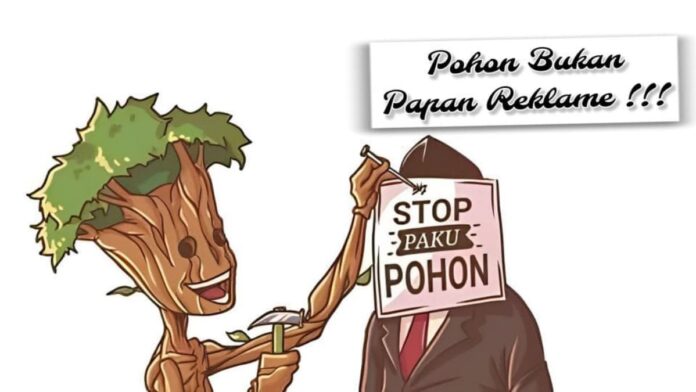 pasang poster di pohon